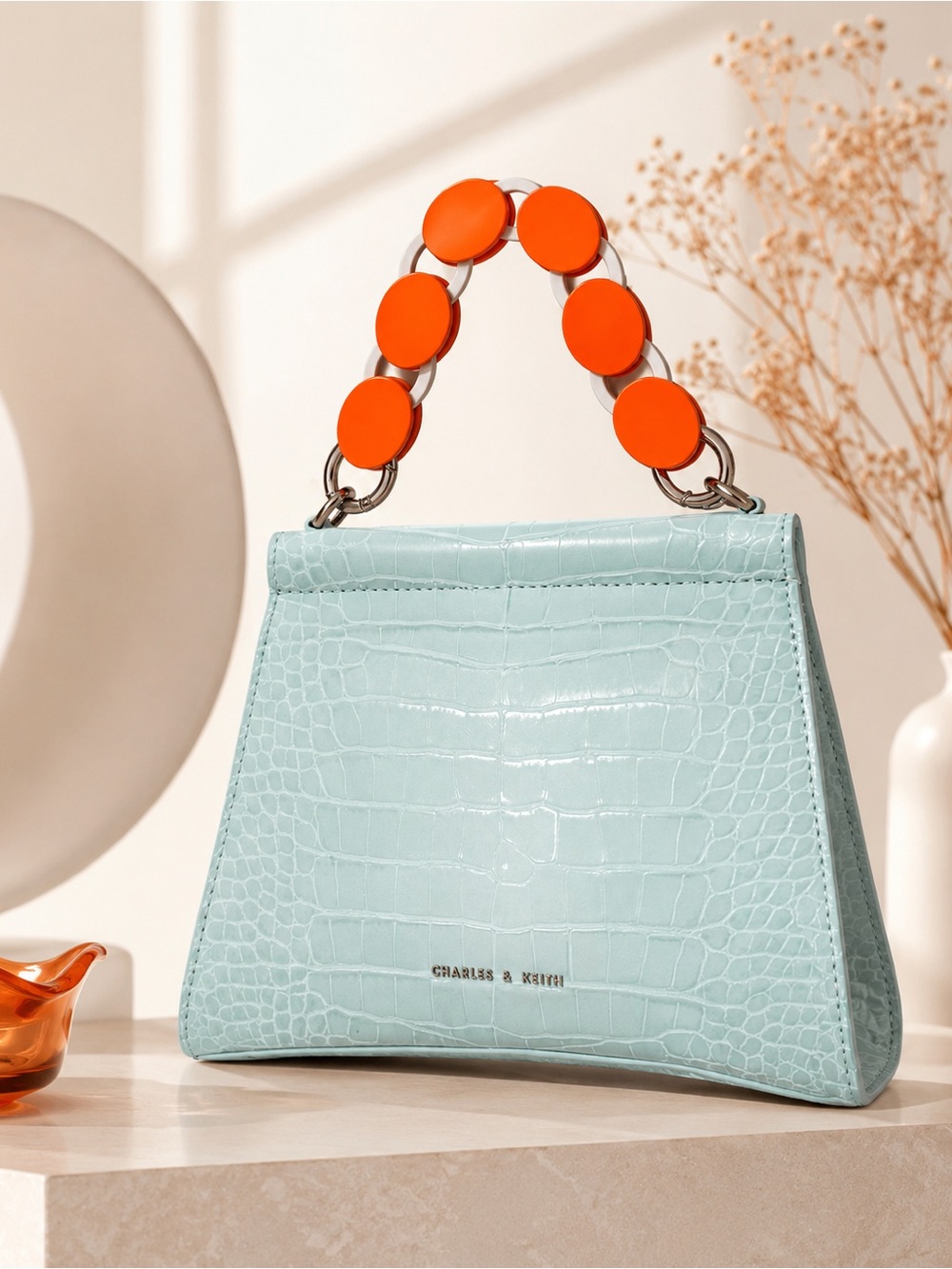 Charles & Keith Mint Croc-Embossed Mini Top-Handle Bag with Orange Disc Accents